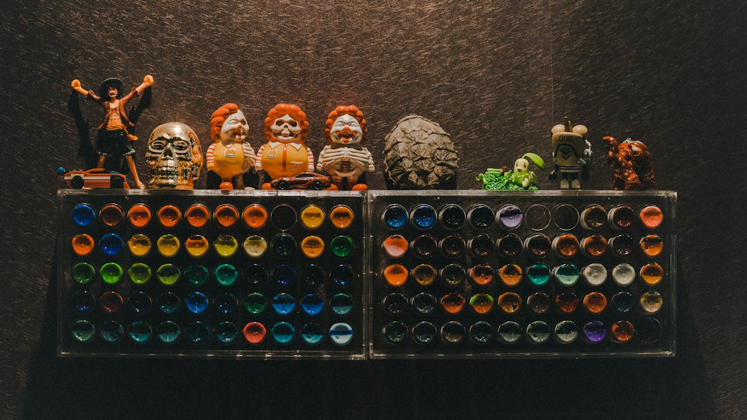 a display of different colored glass bottles and figurines
