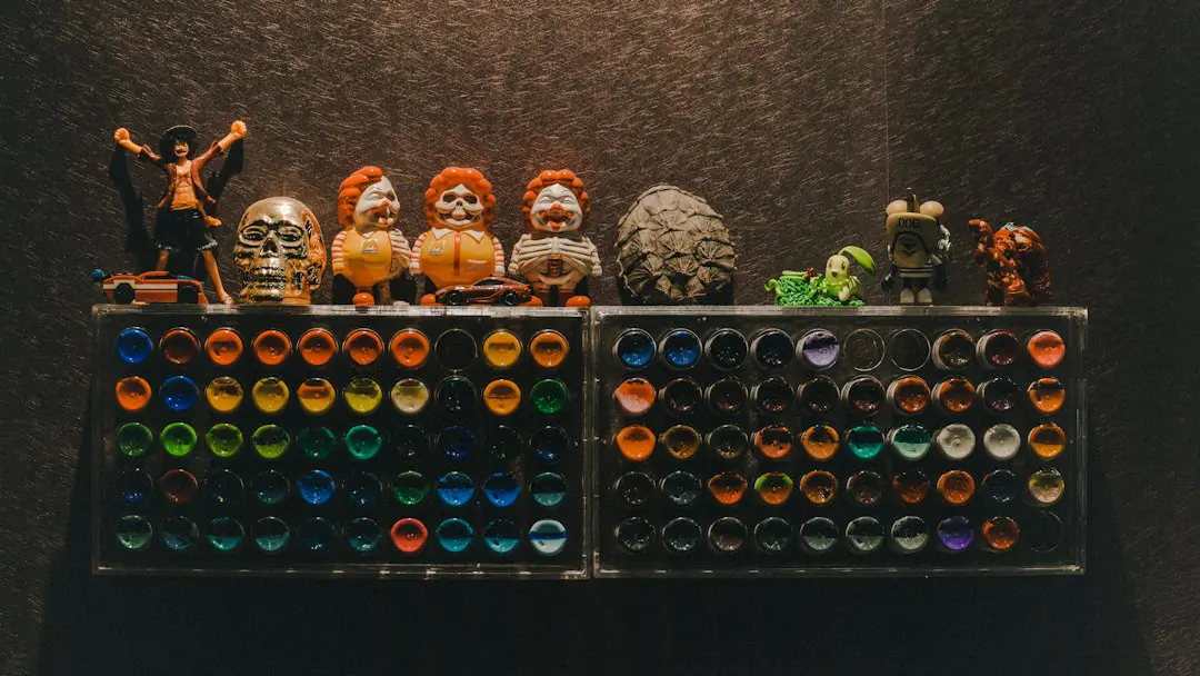 a display of different colored glass bottles and figurines