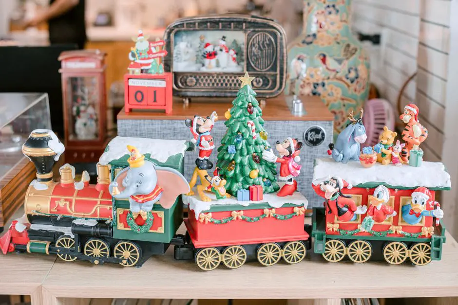 Festive Disney-themed Christmas train decoration with beloved character figurines.